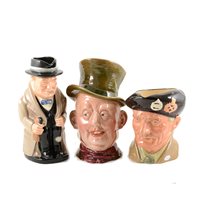 Lot 28 - Three Royal Doulton  toby jugs, Winston Churchill, 23cm and smaller, a Doulton character jug Monty, other character jugs and collectable ceramics.