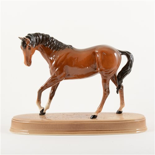 Lot 5 - Beswick model of a chestnut horse, 19cm, with an oval stand, (2).