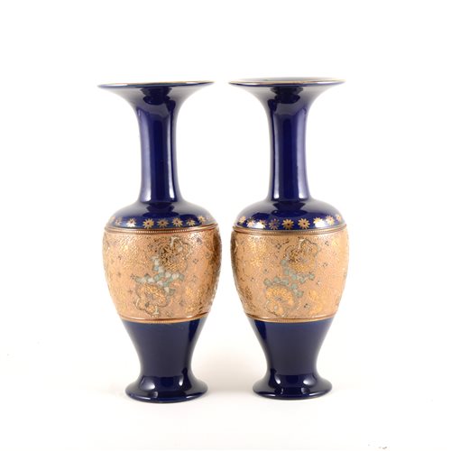 Lot 24 - Pair of Royal Doulton Slater's patent vases, blue ground with a broad mottled floral band, No. 7009, 35cm.