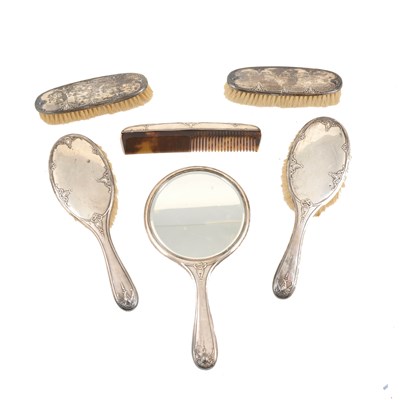 Lot 143 - Silver mounted dressing table set, Birmingham 1929, scrolled outlines including a hand mirror, 23cm.