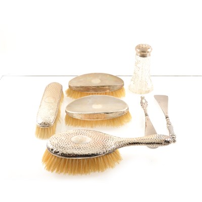 Lot 220 - A silver topped glass dredger by John Grinsell & Sons, Birmingham 1907, a pair of dressing table silver backed brushes, London 1921, two more brushes, button hooks and shoe horns etc