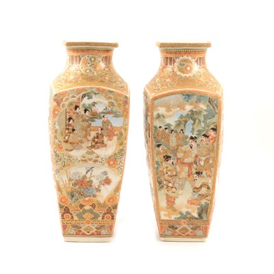 Lot 35 - A pair of Japanese satsuma vases with panels depicting warriors, a family, and flowers, 30cm.