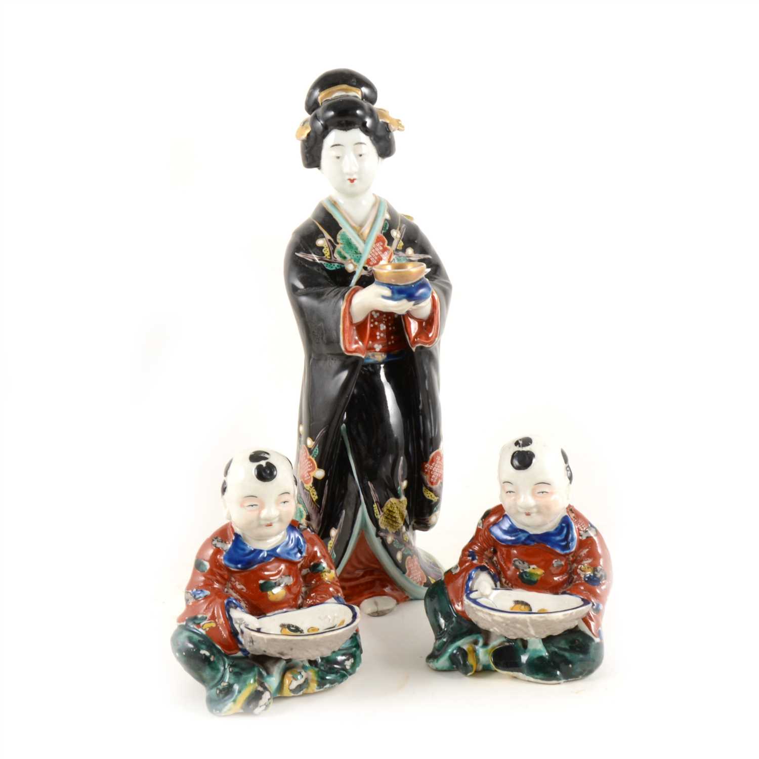 Lot 47 - Three Japanese pottery figures.
