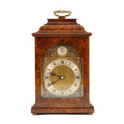 Lot 165 - An Elliott walnut cased bracket clock, brass dial with silvered roman numeral chapter ring, keyless wind movement from back, 28cm.