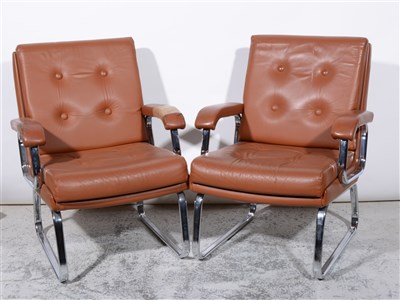 Lot 687 - Two leather and chrome framed armchairs, by Verco