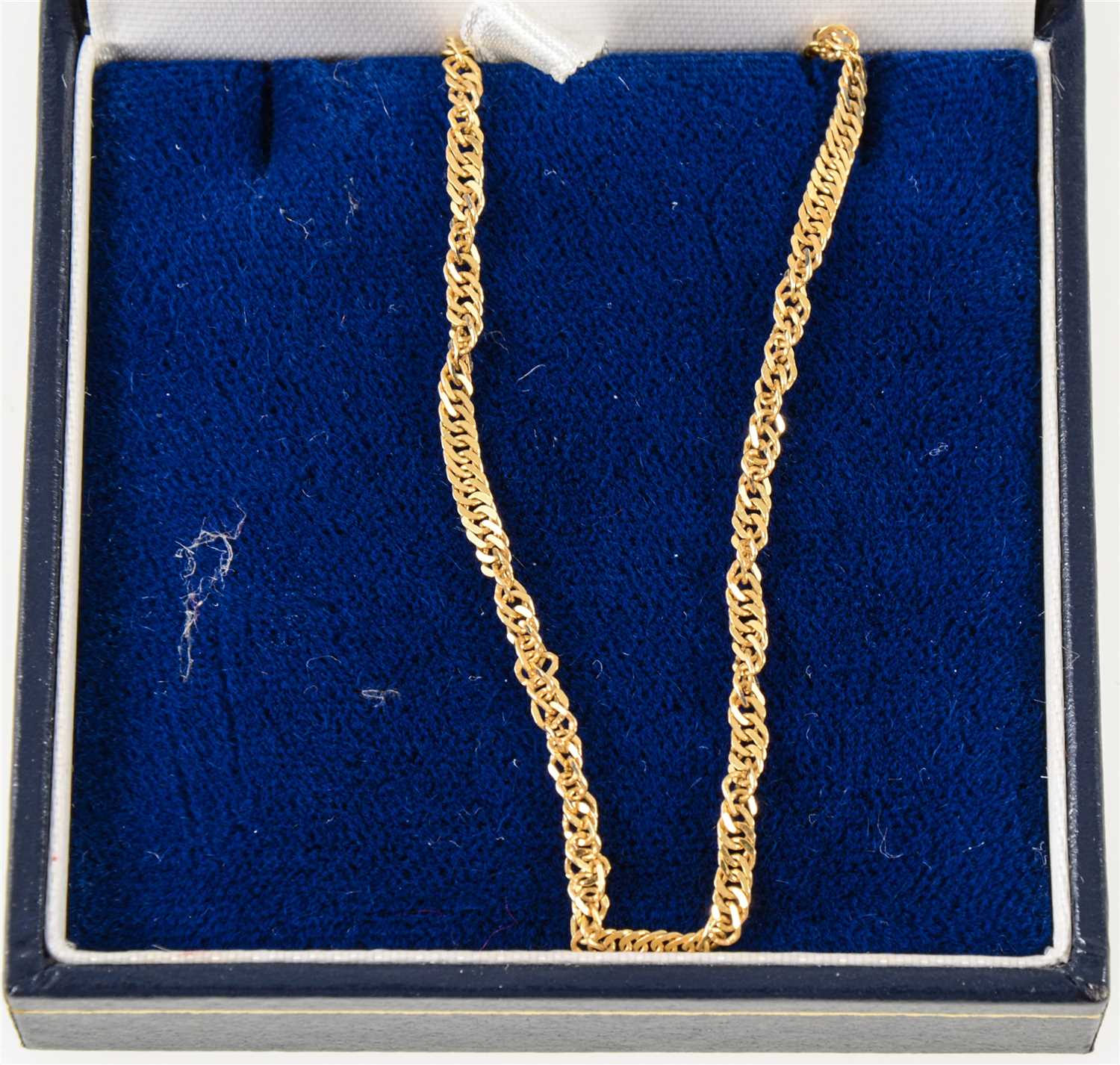 Lot 267 - An 18 carat yellow gold chain necklace, twisted flat curb link 44cm long, approximate weight 4.9gms.
