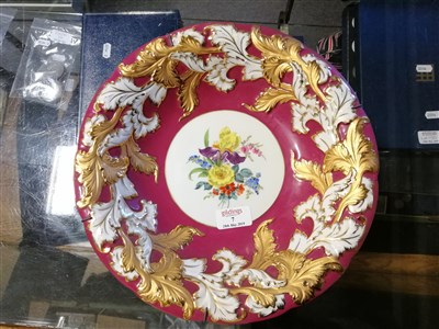 Lot 7 - A Meissen hand painted dish with floral centre, puceborder with gilded acanthus leaf decoration around scalloped rim, impressed C113, 30cm
