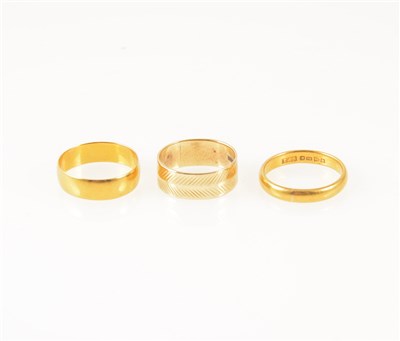 Lot 261 - AMENDMENT - (one ring is 9carat not 18carat) Three gold wedding bands.