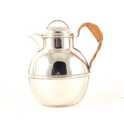 Lot 230 - A silver cream jug, possibly by Oliver & Bower Ltd, round with one horizontal band and two vertical bands, rattan handle, Birmingham 1936, total gross weight approx. 11.5oz, 14.5cm.