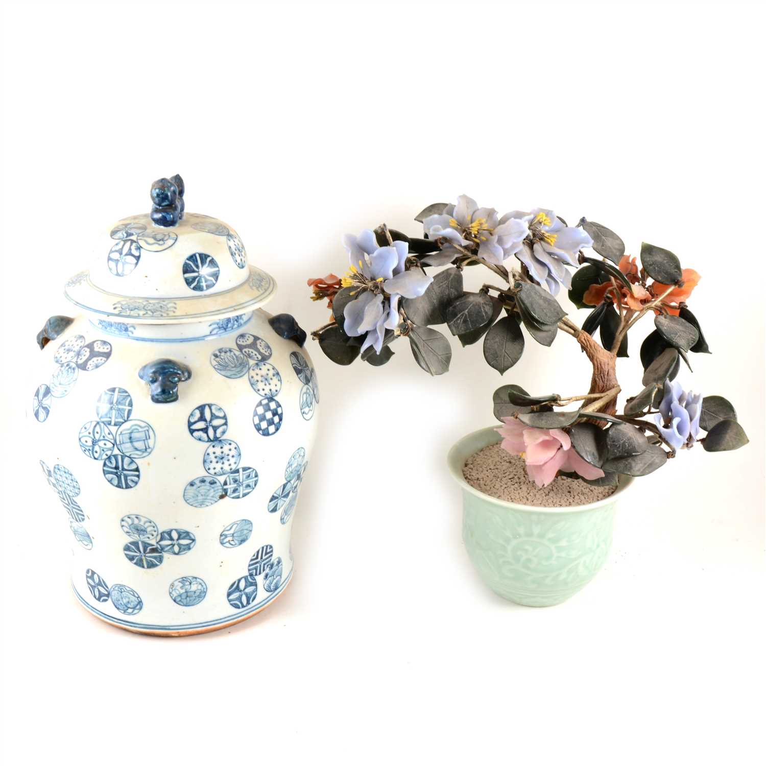 Lot 74 - Chinese hard stone tree plant, celadon jardinière base, 35cm; and a Chinese blue and white covered jar. (2).