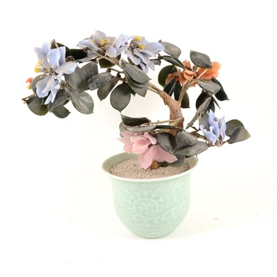 Lot 74 - Chinese hard stone tree plant, celadon jardinière base, 35cm; and a Chinese blue and white covered jar. (2).