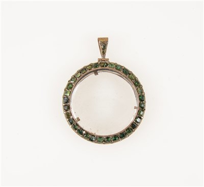 Lot 274 - A circular glass locket with border thirty-two green stones