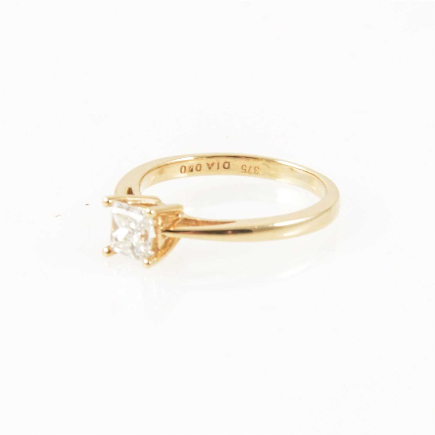 Lot 220 - A diamond solitaire ring, princess cut stone, 9 carat yellow gold mount