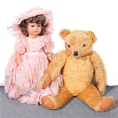 Lot 354 - A large Merrythought plush hygienic toy teddy bear and a composition doll.