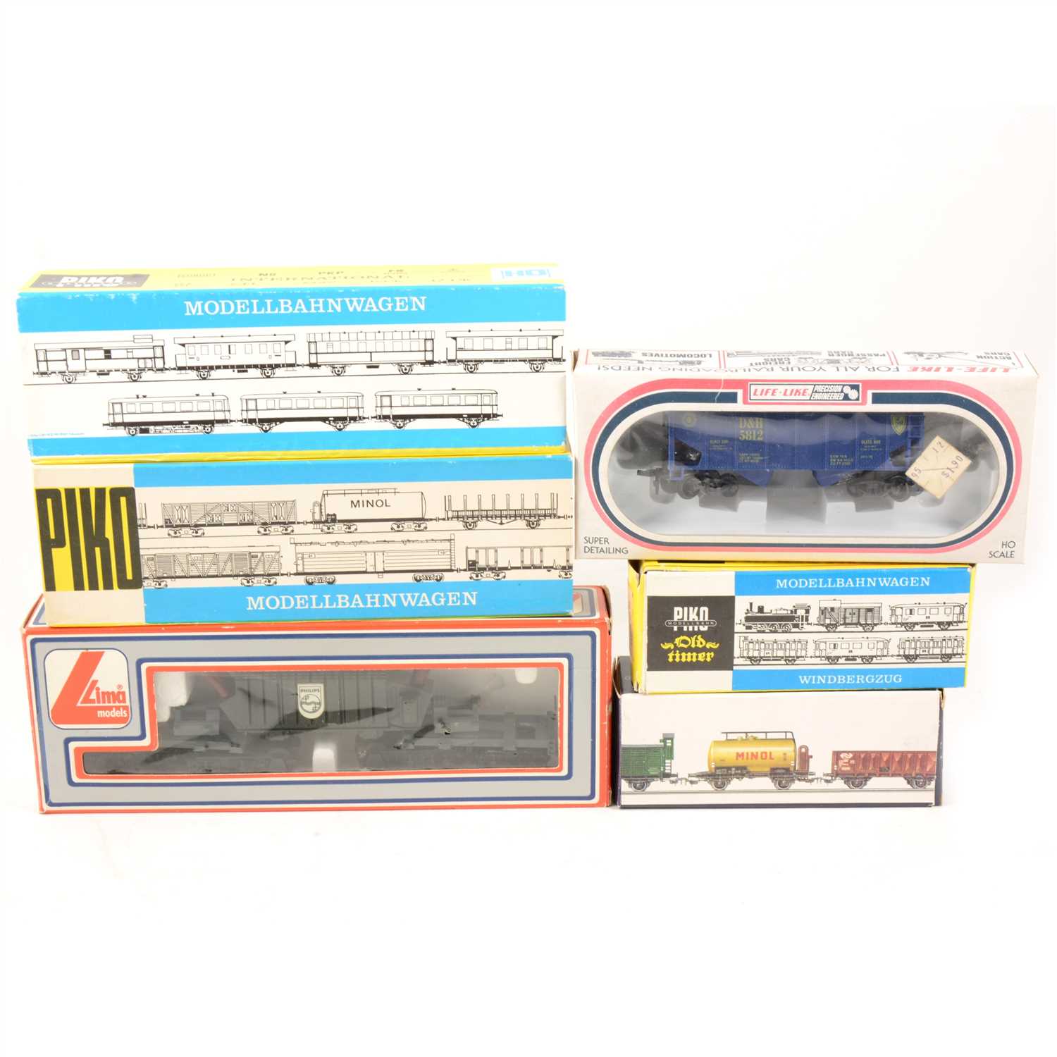 Lot 76 - Thirty HO gauge model railway rolling stock, wagons, petrol tanks etc by Piko and others makers.