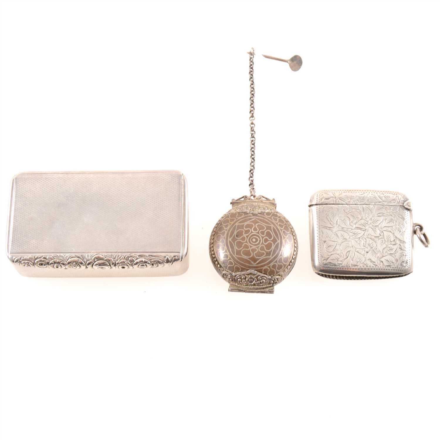 Lot 174 - A silver engine turned snuff box, possibly John Linnit, London, 1815, a silver vesta, and a betel lime (Chunam) box on a chain.