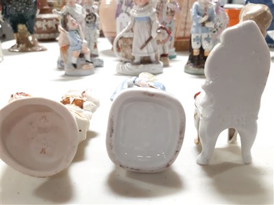 Lot 5 - Pair of German porcelain figures of child musicians, and twelve others.
