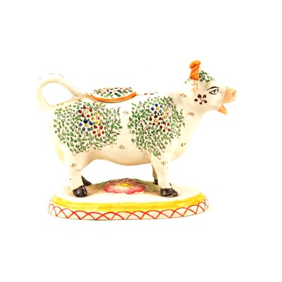 Lot 37 - Staffordshire cow creamer, early 20th Century, ...