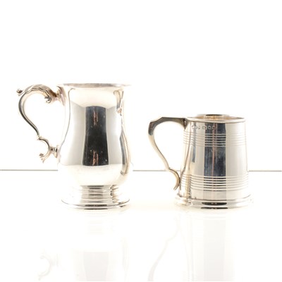 Lot 237 - A silver mug by J W Benson Ltd, decorated with two sets of horizontal bands and engraved with the initial "J", London 1931, 8.2cm high, and another by Walker & Hall, Sheffield 1960, 11.2cm high