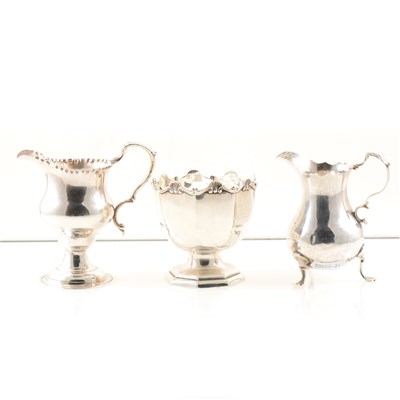 Lot 226 - A silver cream jug, maker's mark rubbed, baluster shape on three legs, scroll handle, London 1761, 10cm, another by Thomas Shepherd, London 1771, 11cm, and a silver pedestal bowl, maker's mark rubbed