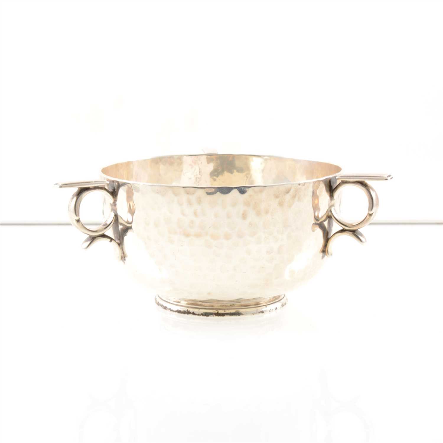Lot 211 - A silver bowl by Boodle & Dunthorne, hammered finish with three handles, base engraved "Dunthorne 13 Lord Street Liverpool", London 1903, approx. weight 8.5oz.