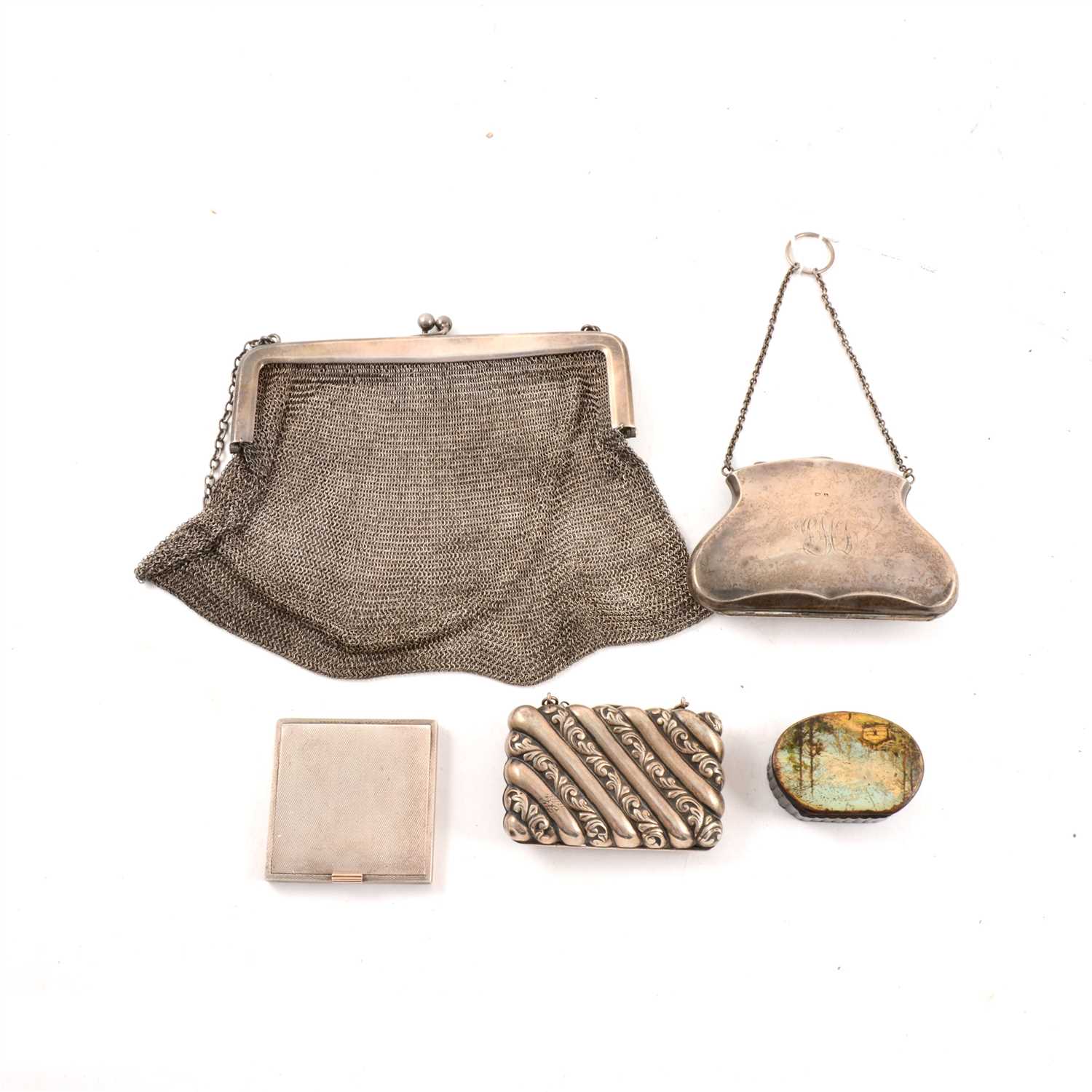 Lot 238 - A silver chain mail dance purse, import marks for London 1917, another purse in the shape of handbag, green material lining, maker's mark rubbed, Birmingham 1910, and another by James Deakin & Sons