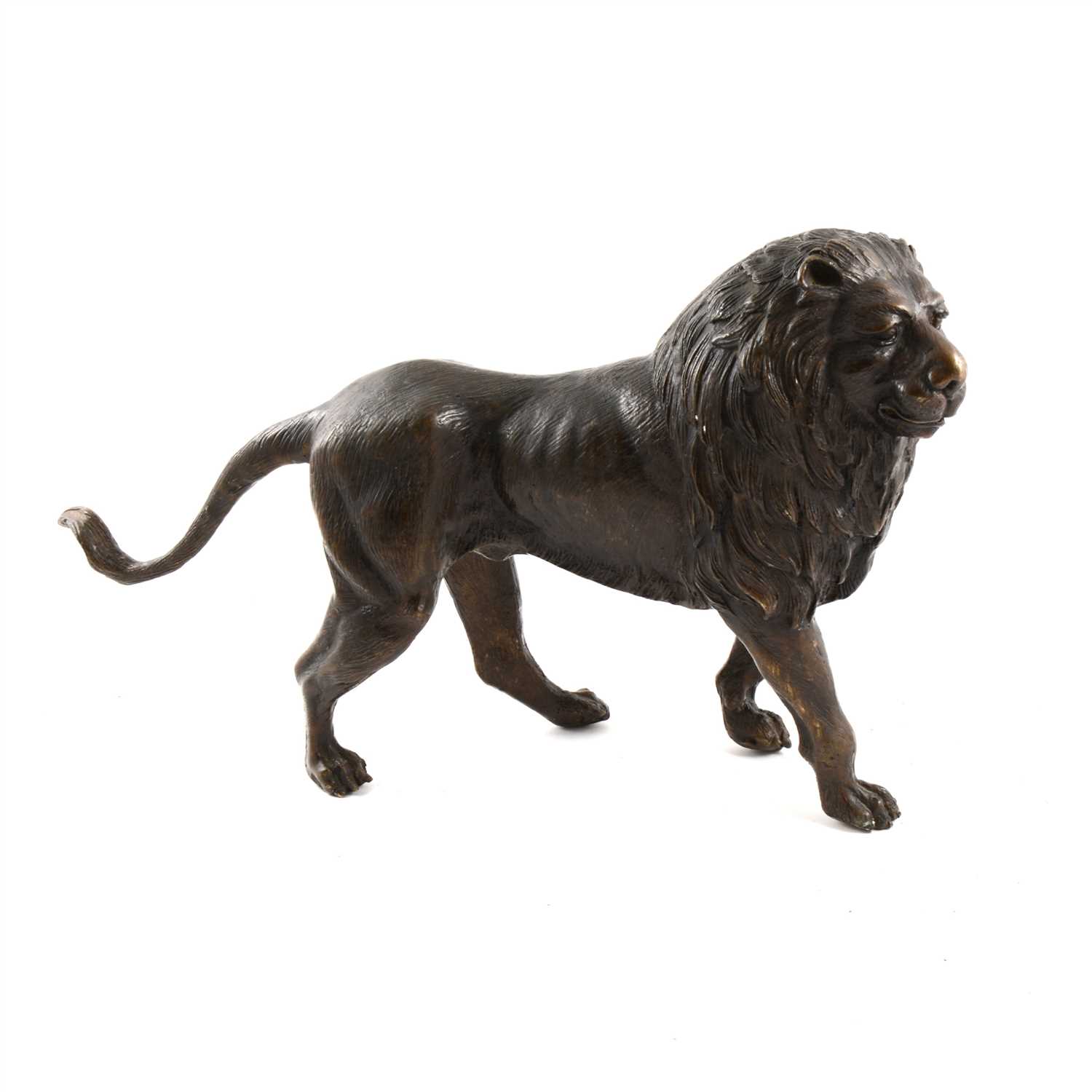 Lot 215 - A bronze model of a standing lion.