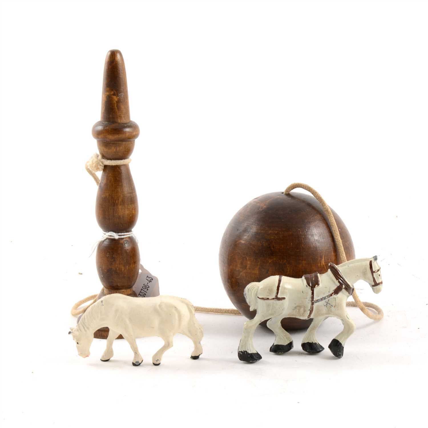 Lot 71 - 19th Century treen, ball and peg game, painted metal horses and other farm animals.