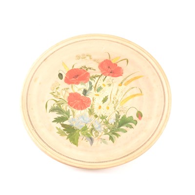 Lot 75 - A pair of buff coloured circular plaques, P. Ipsen, each painted with spring flowers, diameter 37cm.