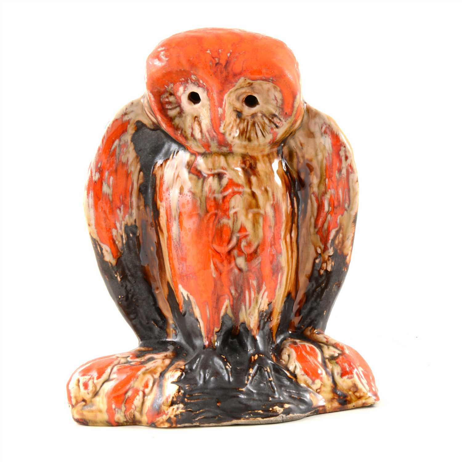 Lot 4 - Eric Leaper, a large pottery model of an owl on a branch, running burnished orange glaze over a manganese body, 25.5cm high