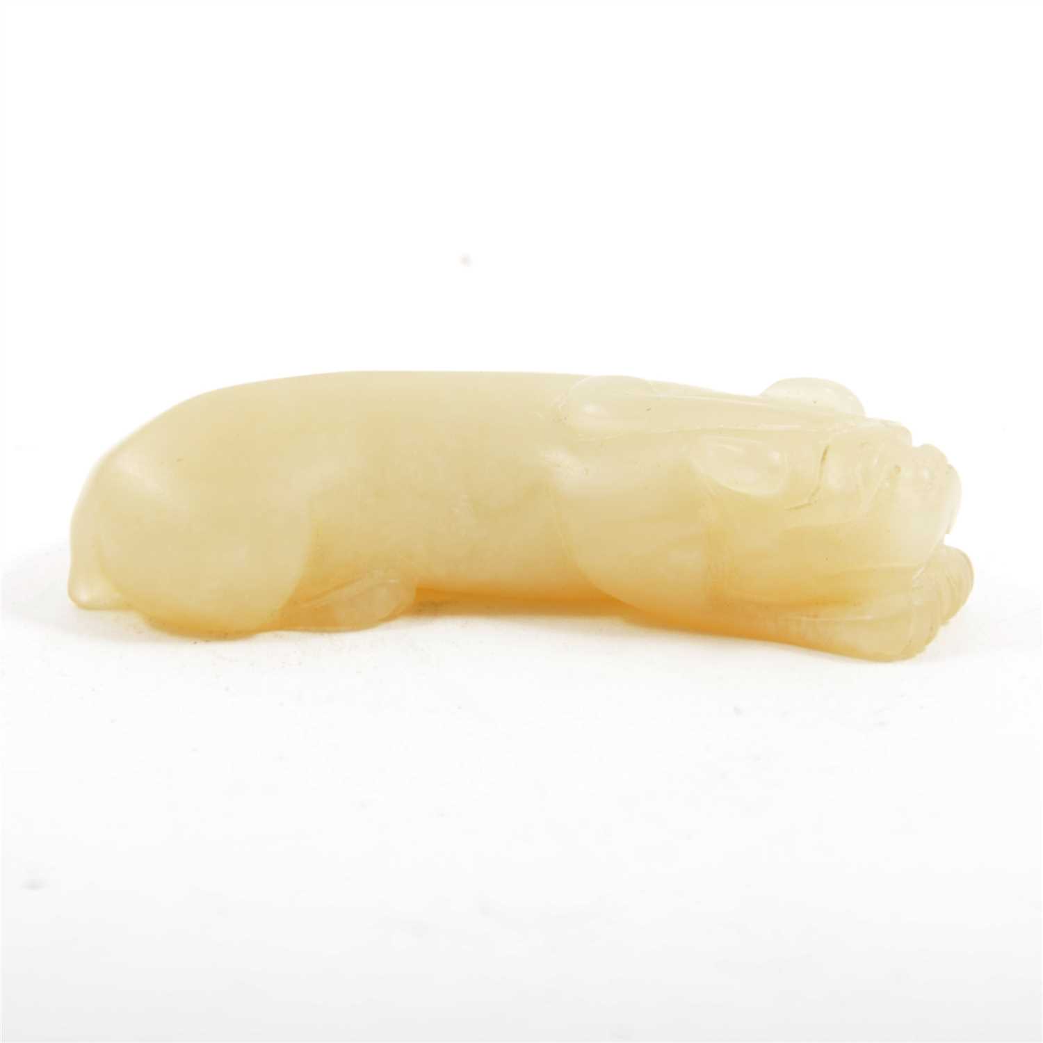Lot 115 - Chinese carved jade model of a lying lion