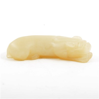 Lot 115 - Chinese carved jade model of a lying lion