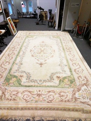 Lot 639 - An Indian wool carpet, in the French style, ...