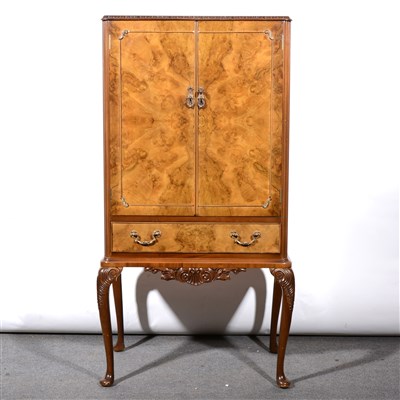 Lot 282 - Reproduction walnut cocktail cabinet with blonde interior.