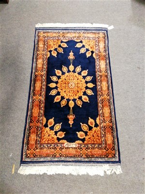 Lot 405 - A Persian rug, two Chinese circular rugs, and another rug.