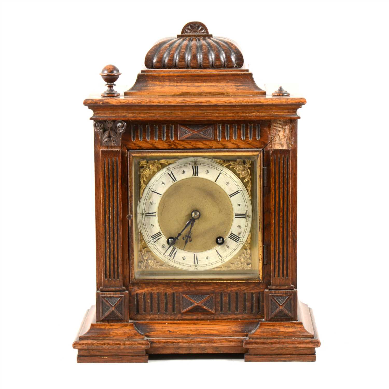 Lot 102 - An oak cased mantel clock