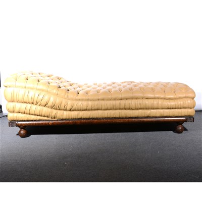 Lot 722 - Empire inspired oak framed chaise longue, upholstered in buttoned tan-coloured leather, length 199cm.