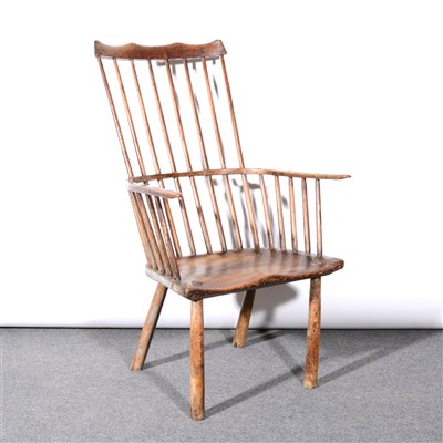 Lot 386 - Primitive elm and ash comb-back Windsor chair, probably West Country, 18th Century