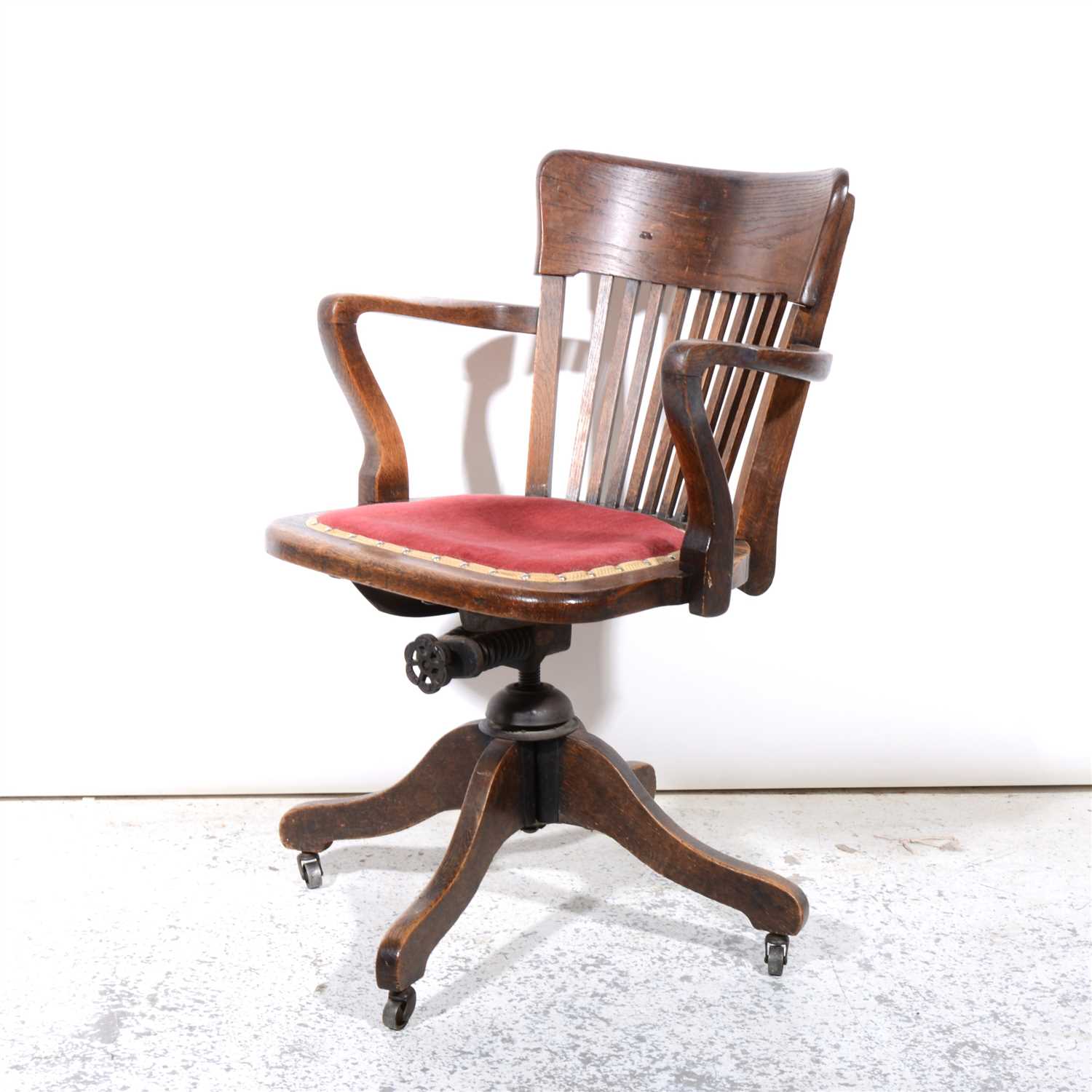 Lot 332 - An oak office swivel chair, early 20th century