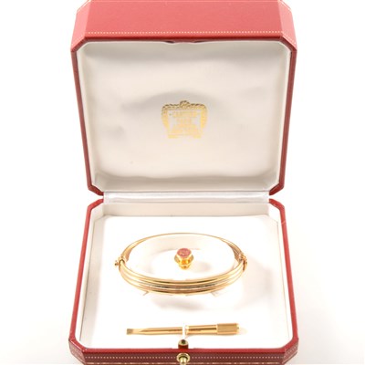 Lot 247 - Cartier - An 18 carat tri-colour gold bangle.