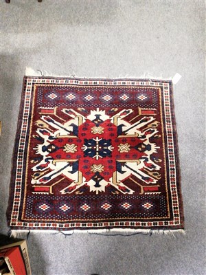 Lot 430 - A small Caucasian rug, central medallion