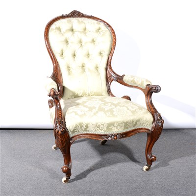 Lot 357 - A Victorian carved walnut easychair