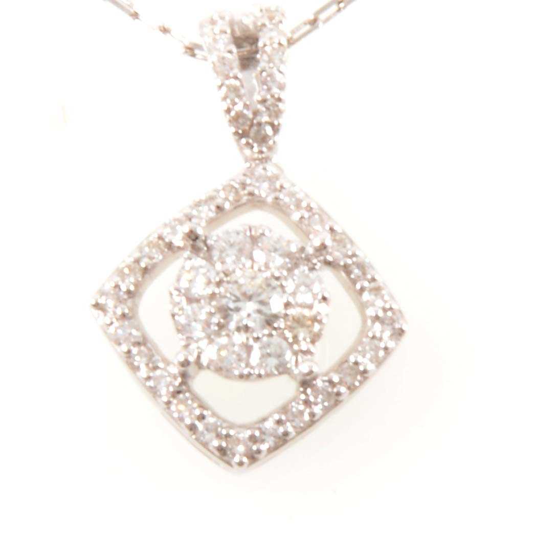 Lot 215 - A diamond cluster pendant and chain.