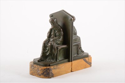 Lot 238A - A pair of patinated bronze bookends sculpted as a seated lady