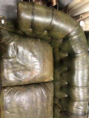 Lot 486 - Button leather Chesterfield settee, scrolled ends, 217cm.