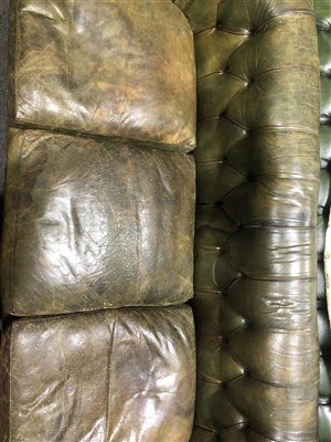 Lot 486 - Button leather Chesterfield settee, scrolled ends, 217cm.