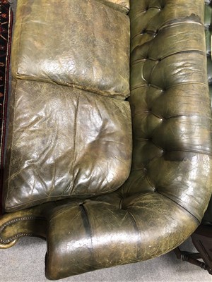 Lot 486 - Button leather Chesterfield settee, scrolled ends, 217cm.