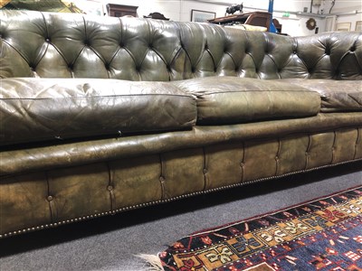 Lot 486 - Button leather Chesterfield settee, scrolled ends, 217cm.