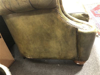 Lot 486 - Button leather Chesterfield settee, scrolled ends, 217cm.