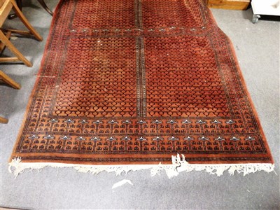 Lot 584 - Indian red ground carpet, tiled field.